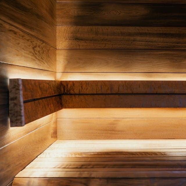 Private sauna room with warm wood interior